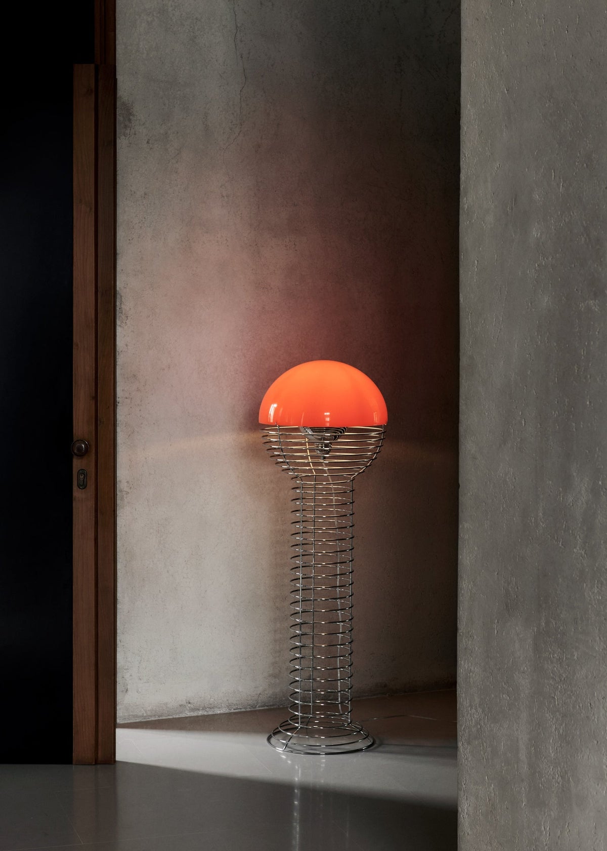 Wire Floor Lamp by Verner Panton in chrome and orange, an open wire cage under a domed shade