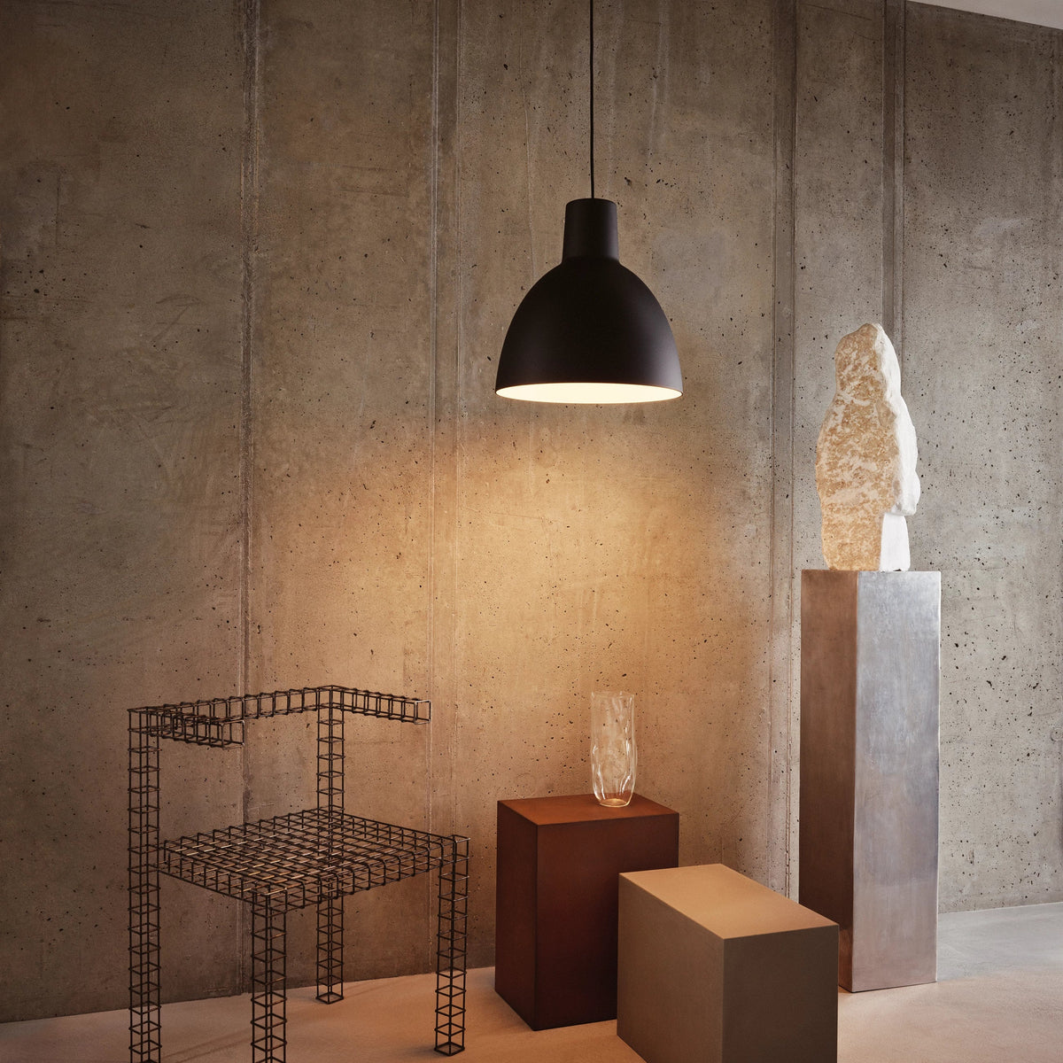 Black Toldbod Pendant Ø400 by Louis Poulsen hanging in The Silo on the Copenhagen harbourfront