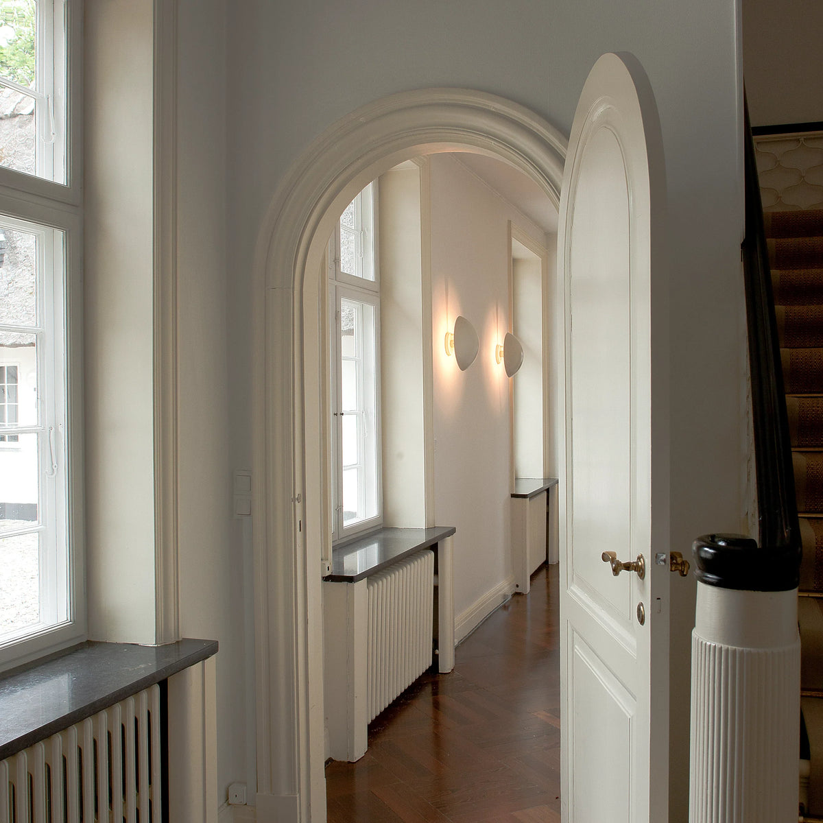 PH Hat Wall Lamp by Poul Henningsen mounted on a wall in an interior