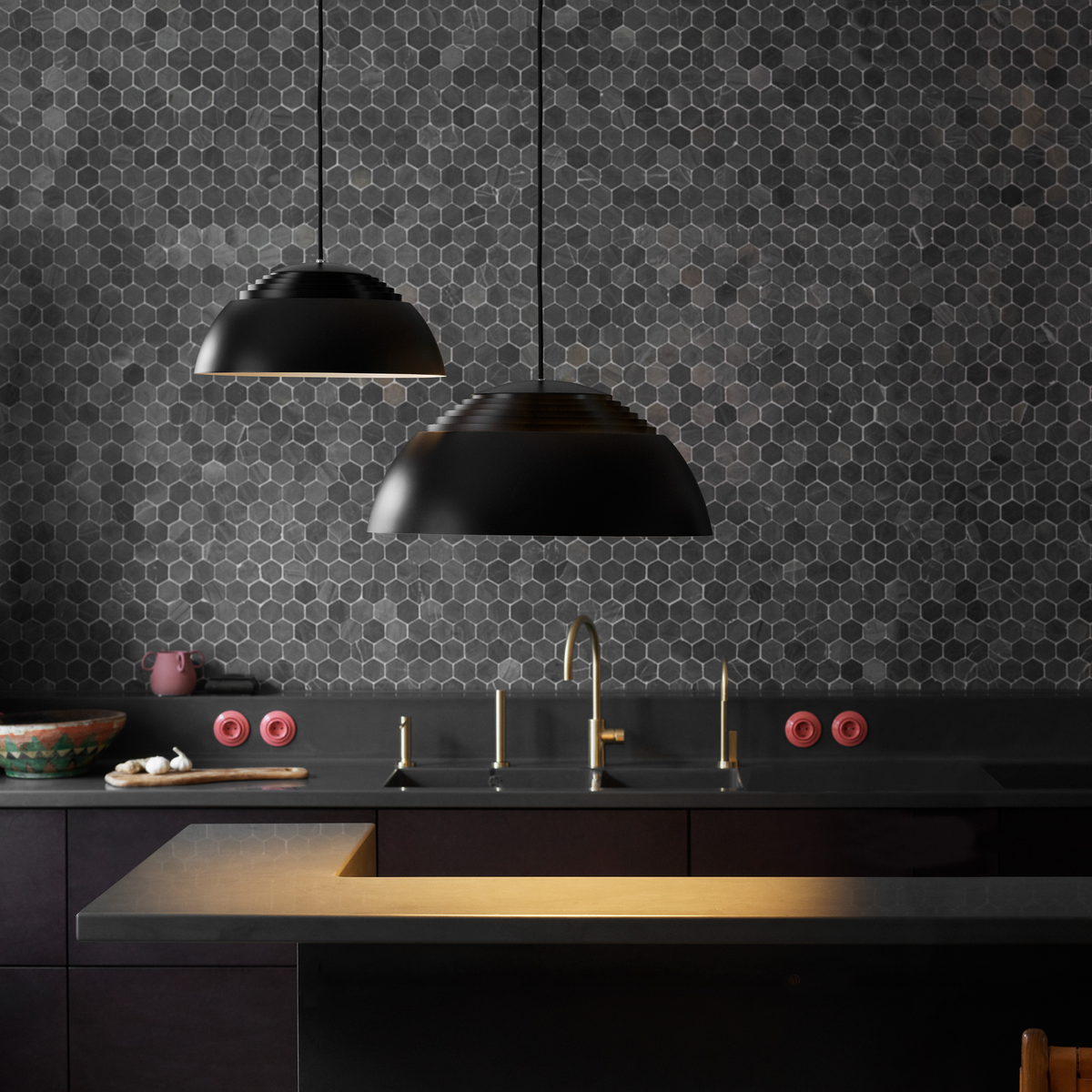 AJ Royal Ø370 and Ø500 in black hung side by side above a dark kitchen counter
