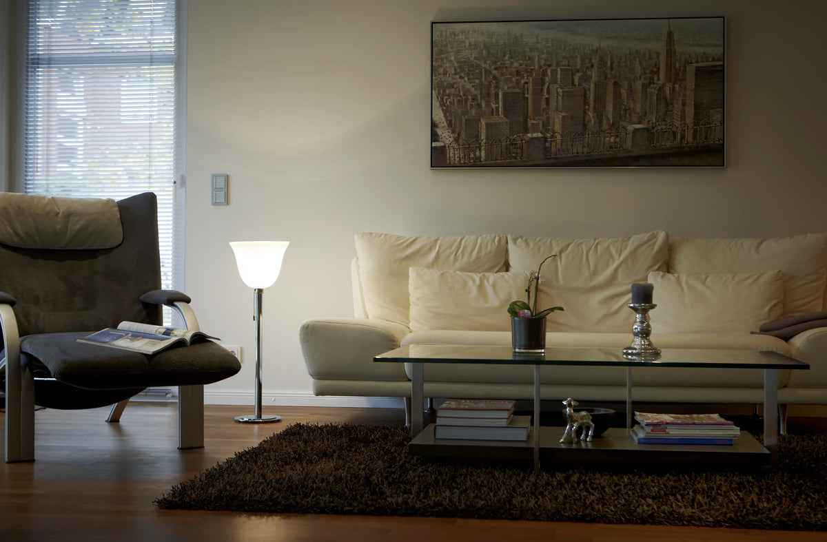 AD 30 Art Déco Floor Lamp by TECNOLUMEN with its open opal-glass shade, in an interior