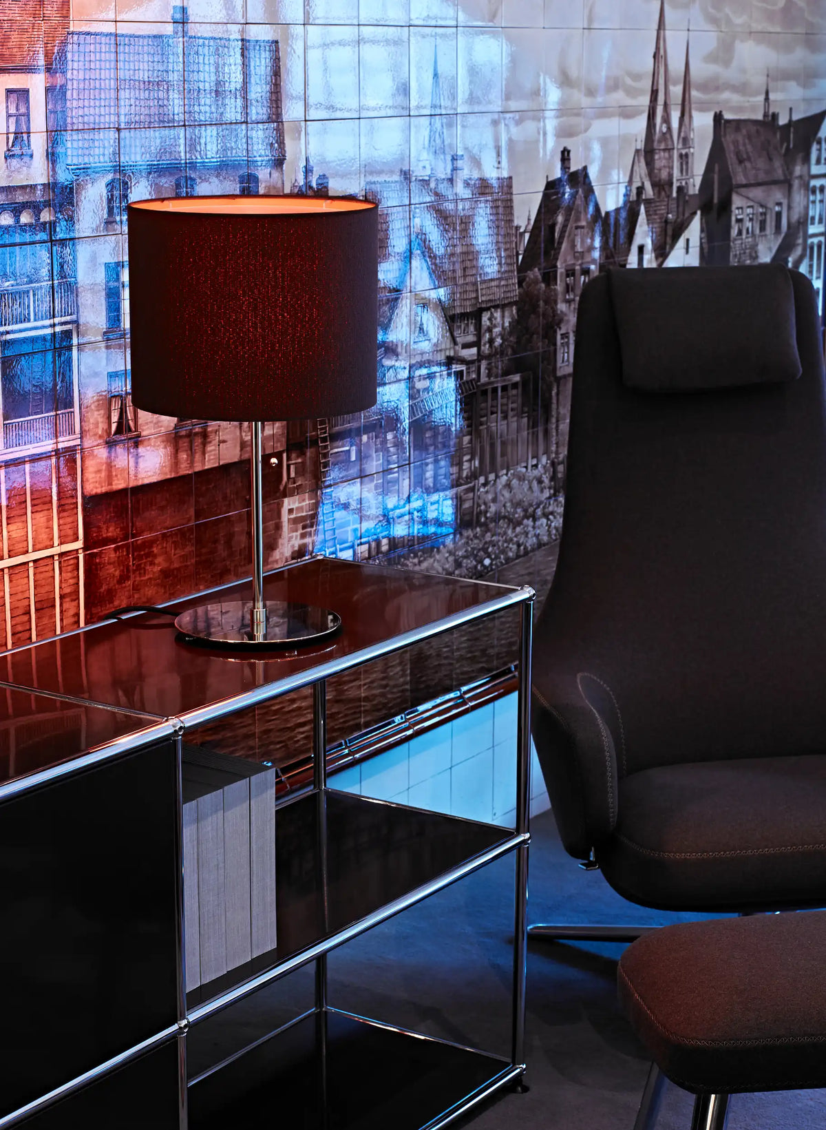 TLWS 05 table lamp with a dark linen shade on a black sideboard beside an armchair