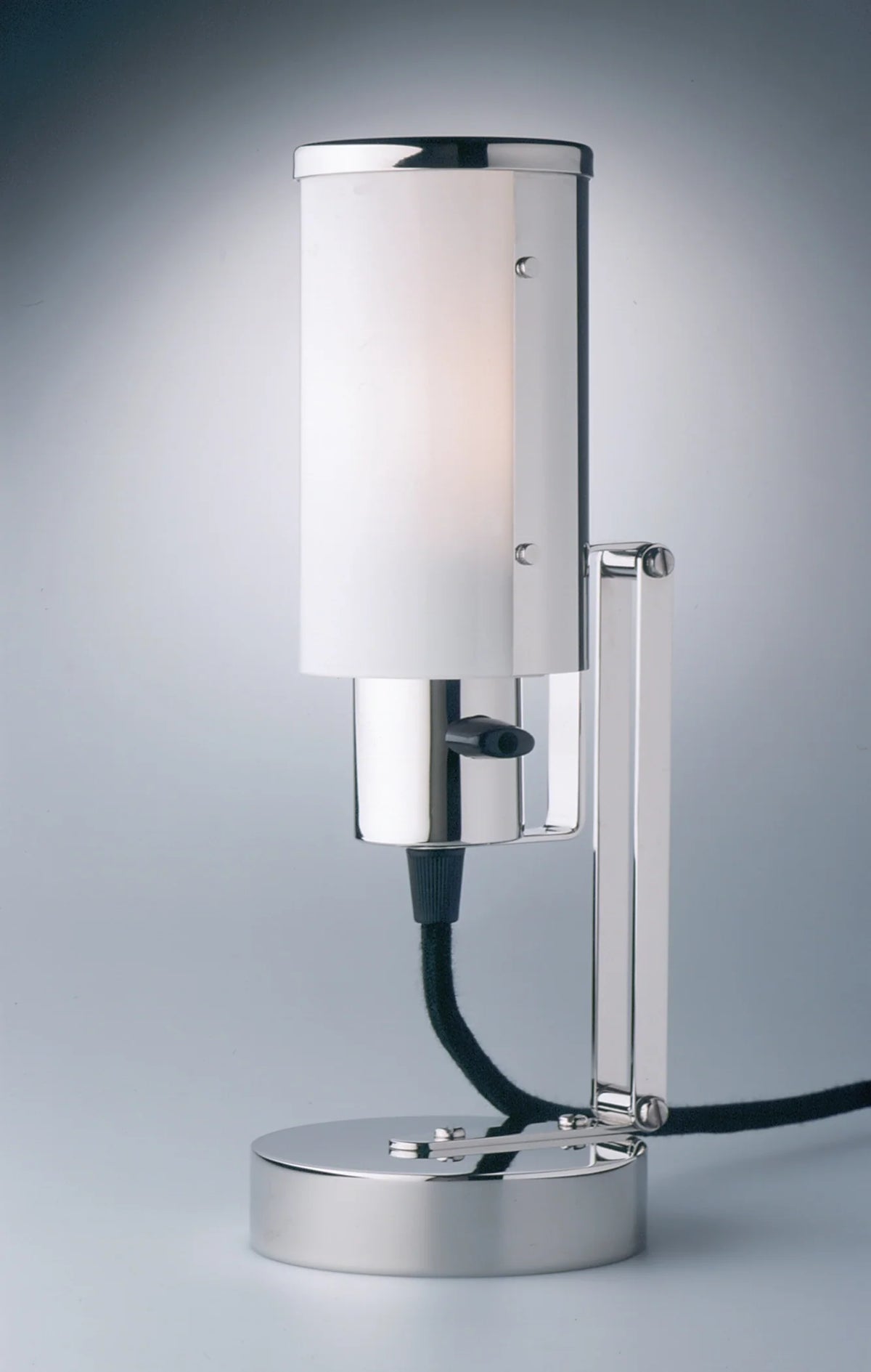 WNL 30 Wagenfeld Multi-Purpose Lamp in nickel-plated brass with a lit opal-glass cylinder shade